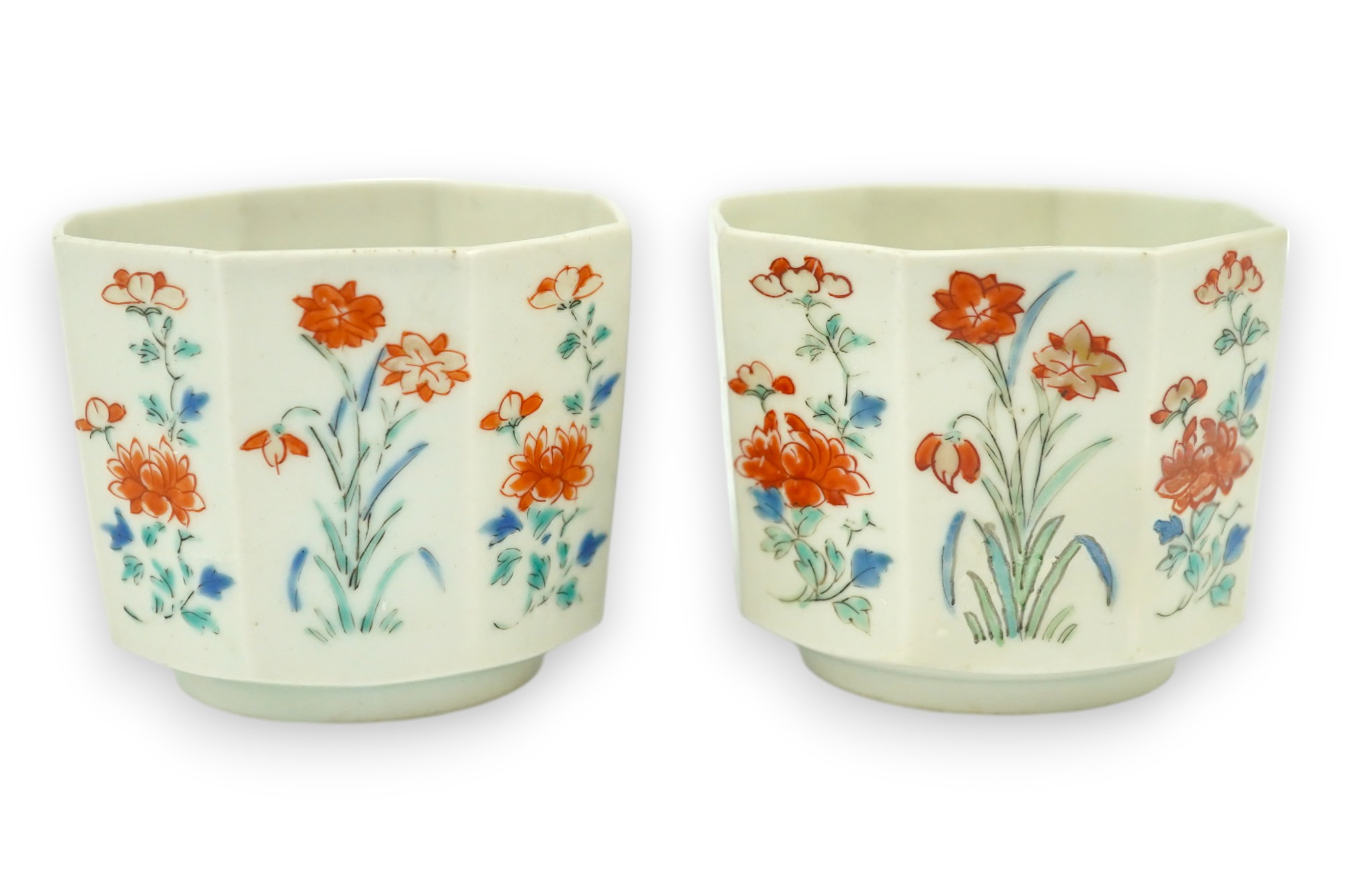 A pair of Japanese kakiemon octagonal porcelain cups, probably Edo period, 5.5cm high. Condition - one restored the other hairline cracks